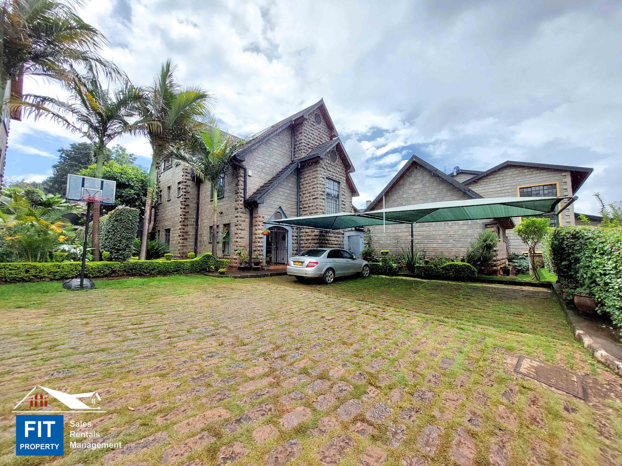 Elegant Stone Townhouse in Mzima Springs, Lavington, Nairobi. Has Architectural details, such as attic ceilings with wooden trusses. Price: KES 90M